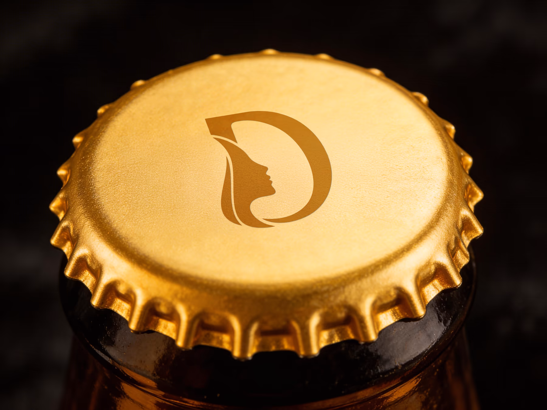 DAM logo applied to a gold bottle cap